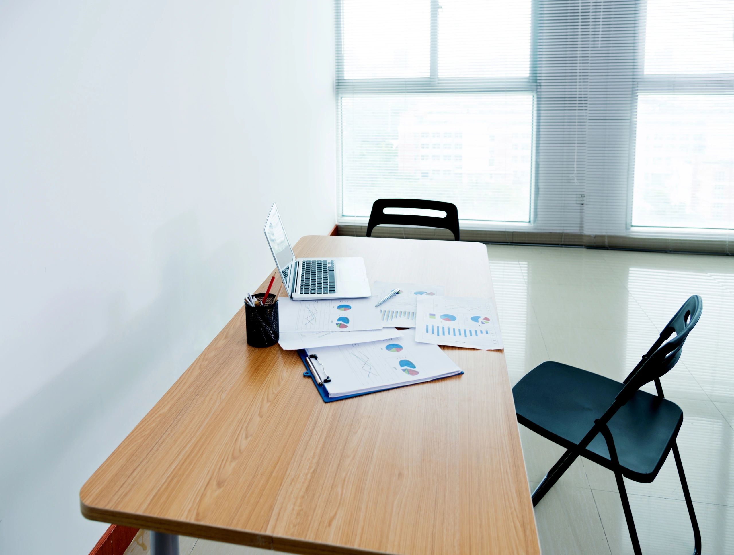 Compliance documents and laptop prepared for refund representation review